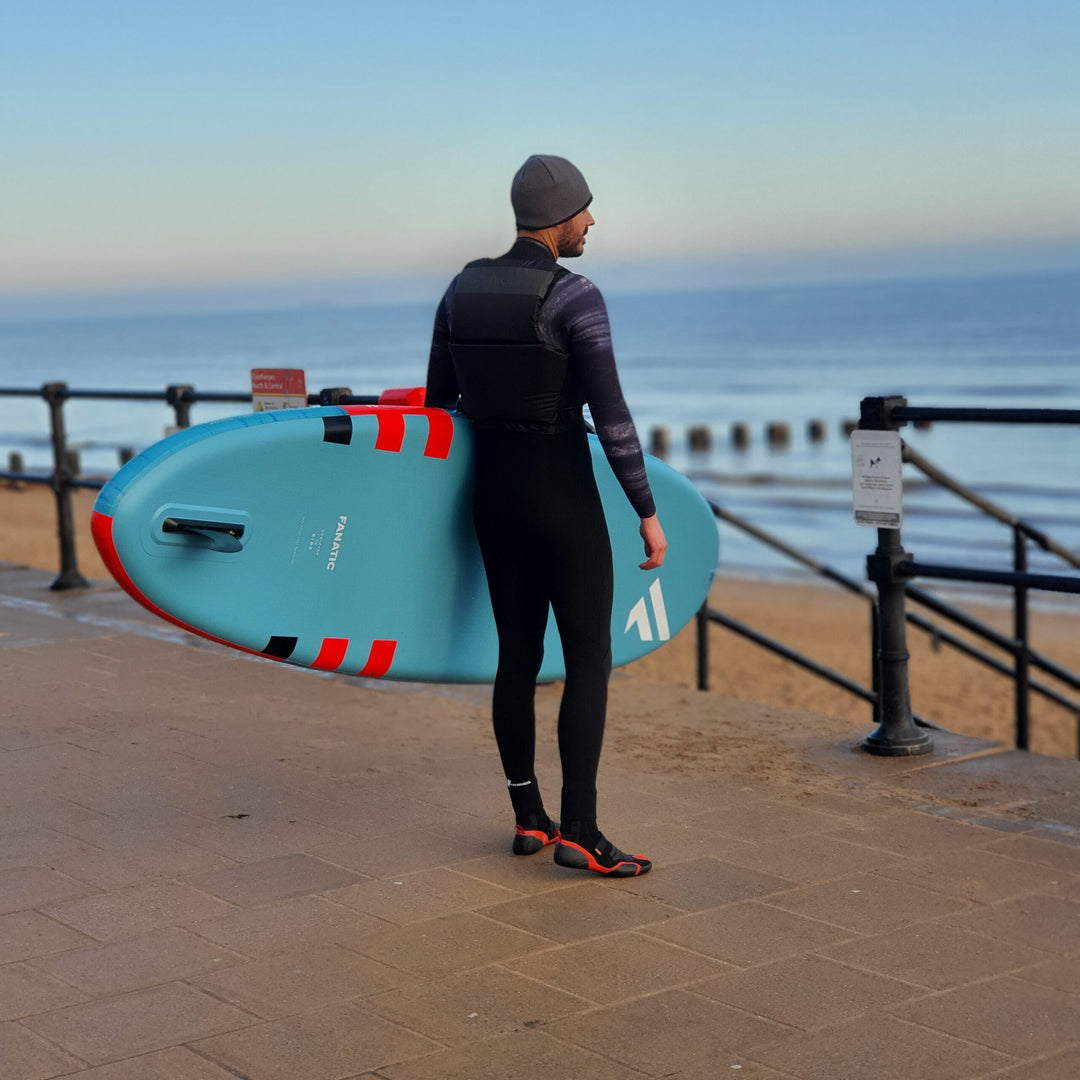 Black Spinlock Foil Buoyancy Aid modelled by a Paddleboarder