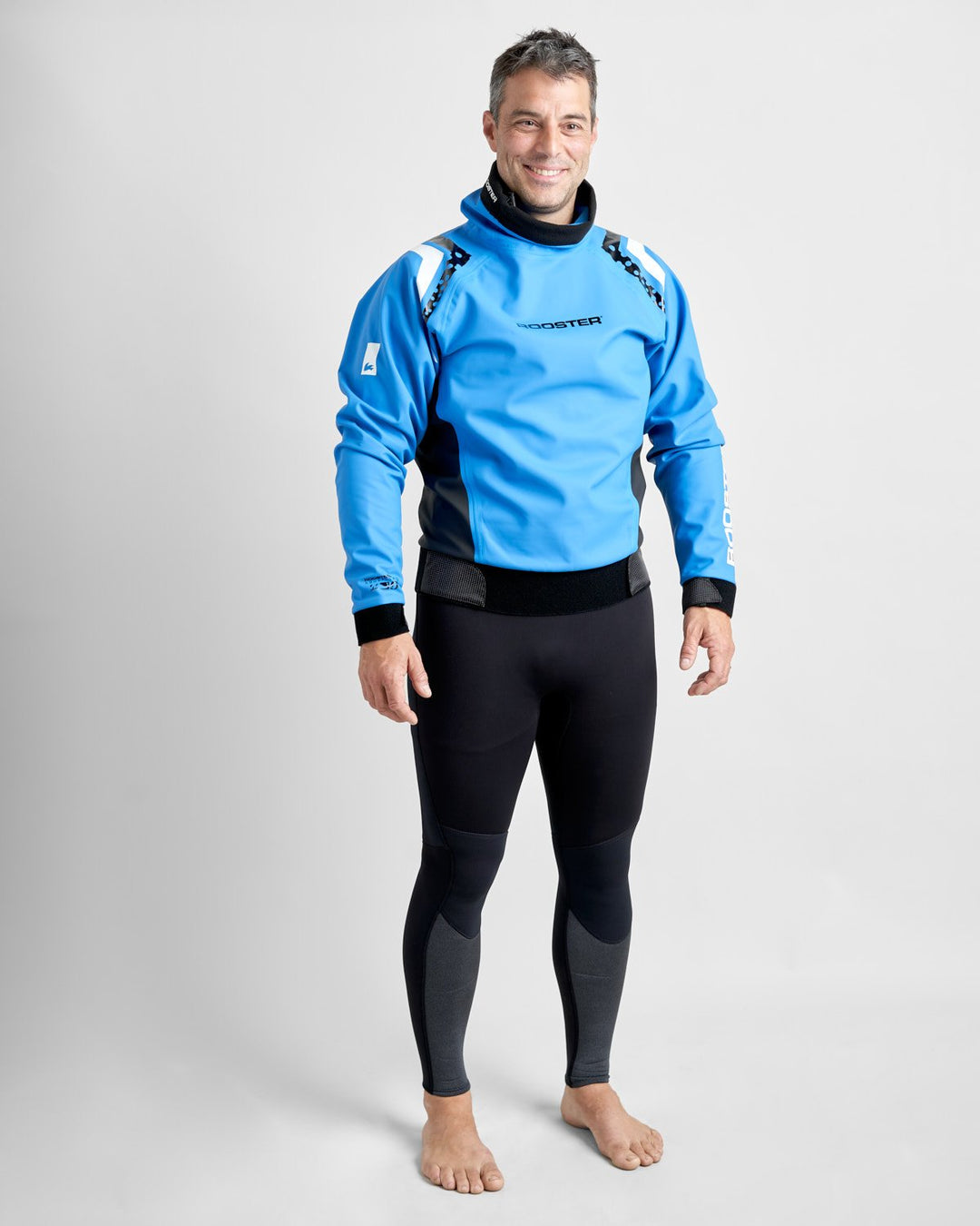 Front View of Rooster Pro Aquafleece Top in Blue, Worn by a Male Model in a studio