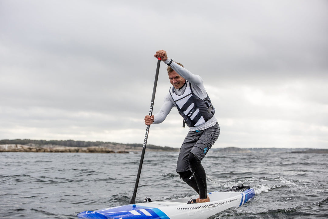 Baltic SUP Pro Buoyancy Aid In White Action Shot