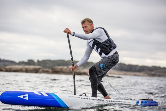 Baltic SUP Pro Buoyancy Aid in White Worn On The Water