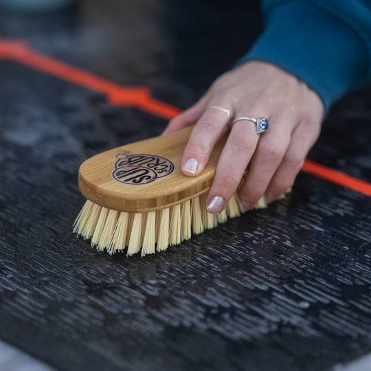 SUPscrub Bamboo brush on Paddleboard