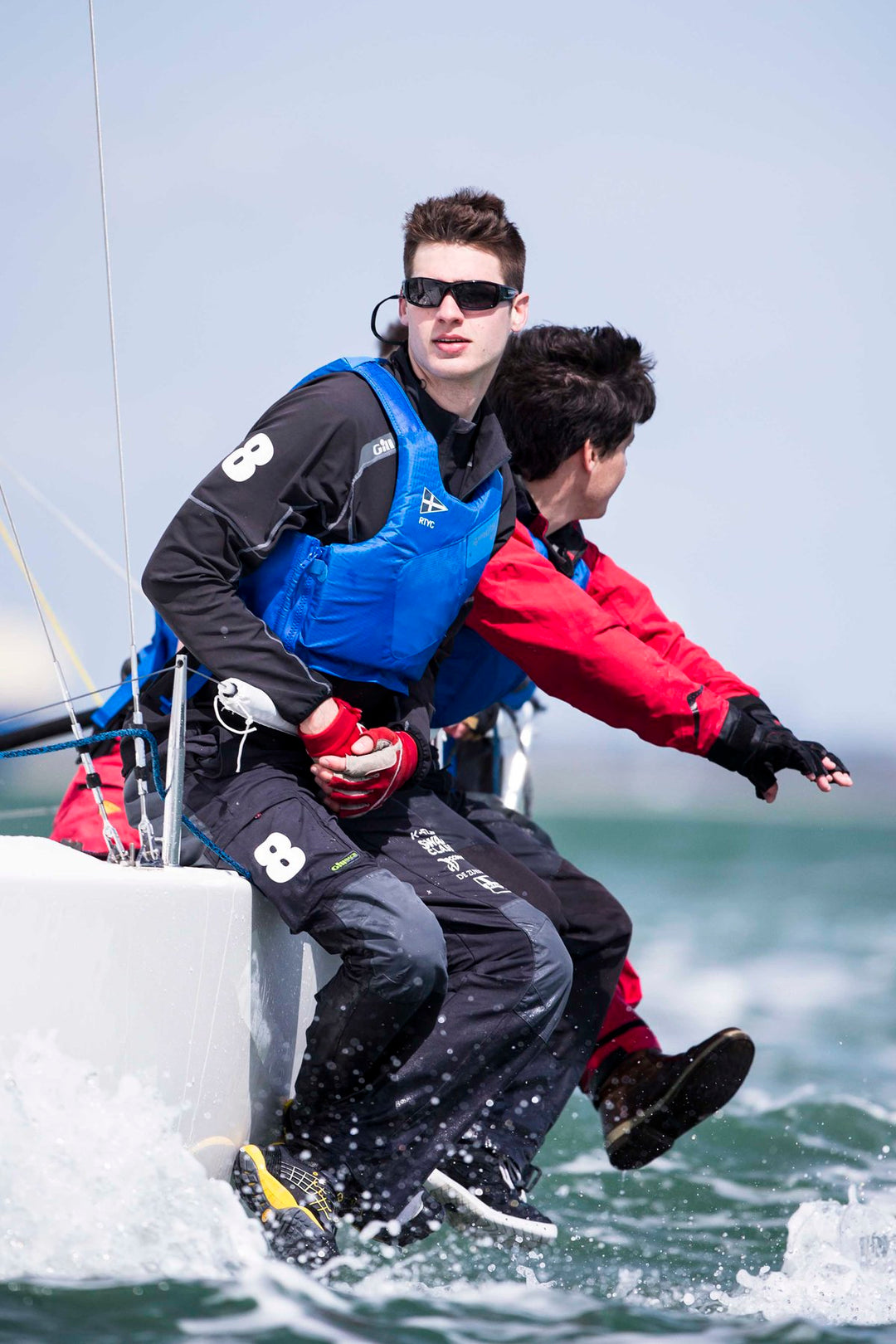 Sailor wearing blue Spinlock Wing buoyancy aid