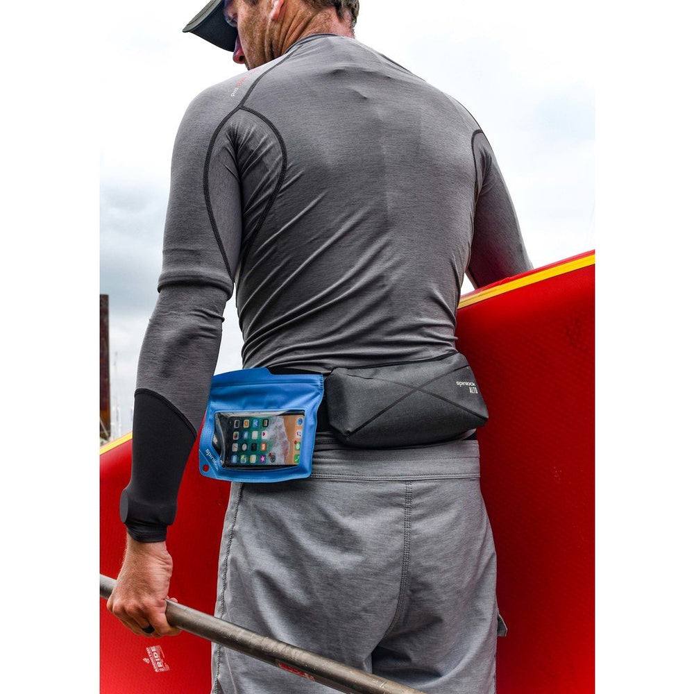 Blue Spinlock waterproof Pack worn by a Paddleboarder