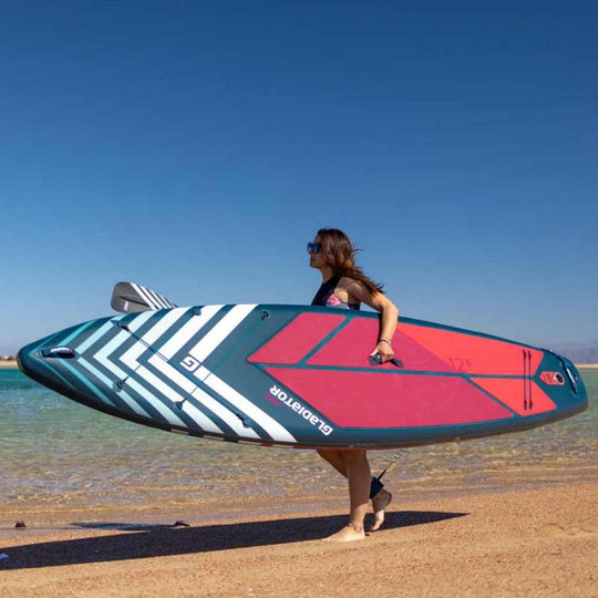 Gladiator Pro 12'6 S Paddleboard being carried on the beach